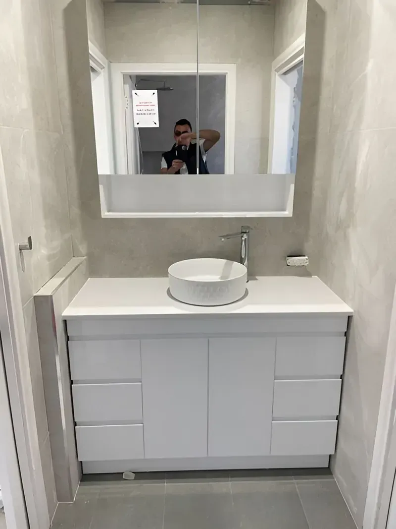 Modern White Bathroom Vanity With Round Sink and Mirror— Piscopo Kitchens Plus In Forster, NSW