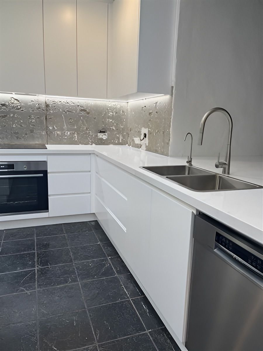 Modern Kitchen With Sleek White Cabinets and Countertops — Piscopo Kitchens Plus In Wingham, NSW