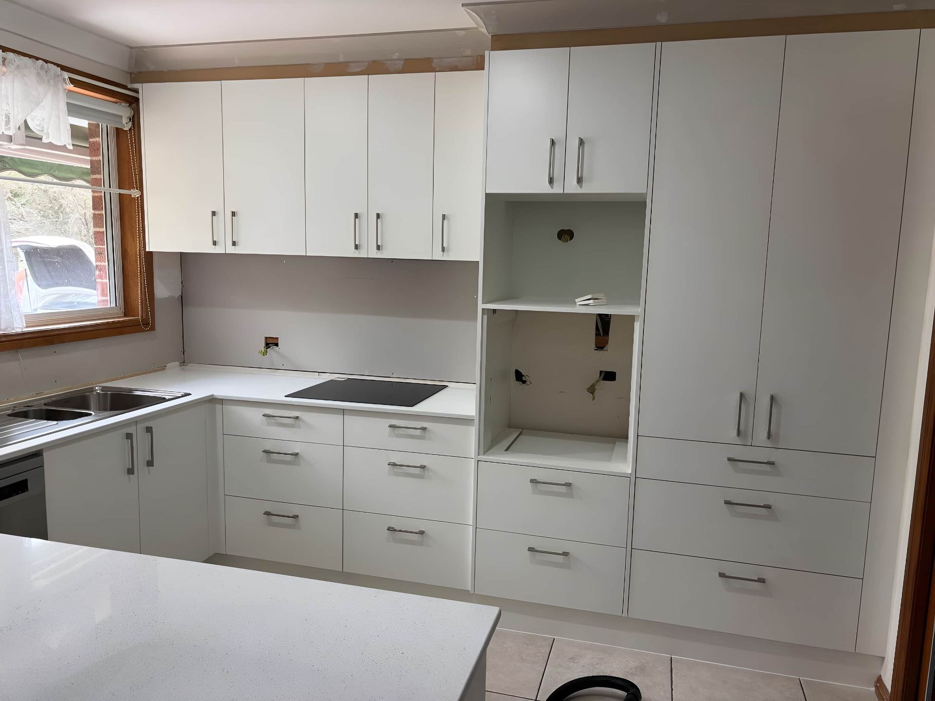 A Kitchen With Cabinets — Piscopo Kitchens Plus In Tuncurry, NSW