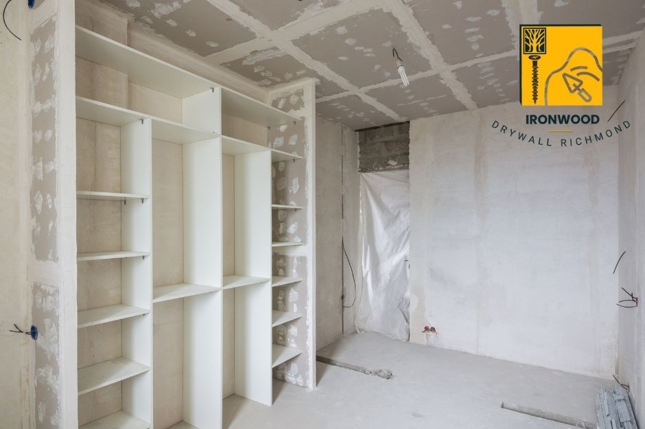 Large and bright walk-in closet after installing drywall with cubby holes.