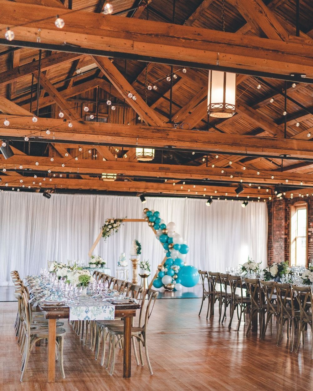 blue and gold balloon arch