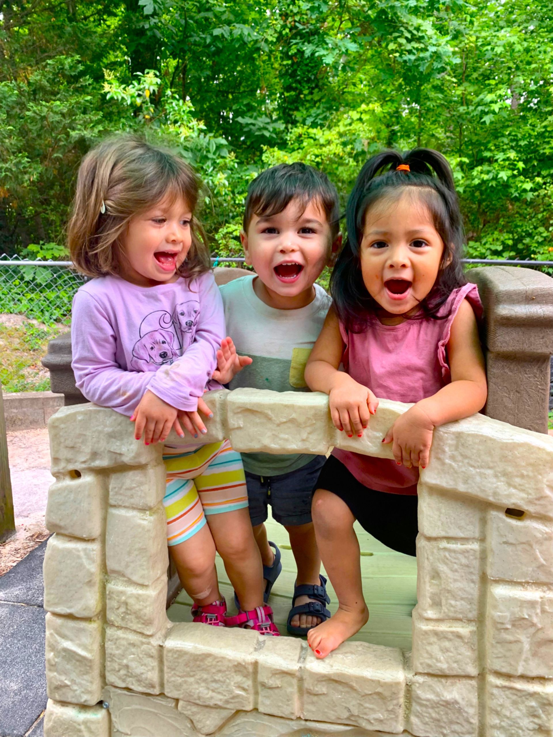 Montessori toddlers playing outside