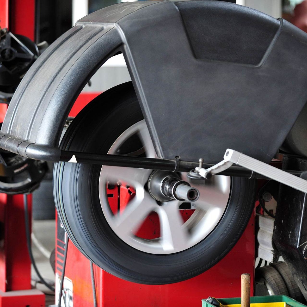 Tire change work being done on a car — San Antonio, TX — Rockguard Autoglass Tire change work being done on a car — San Antonio, TX — Rockguard Autoglass