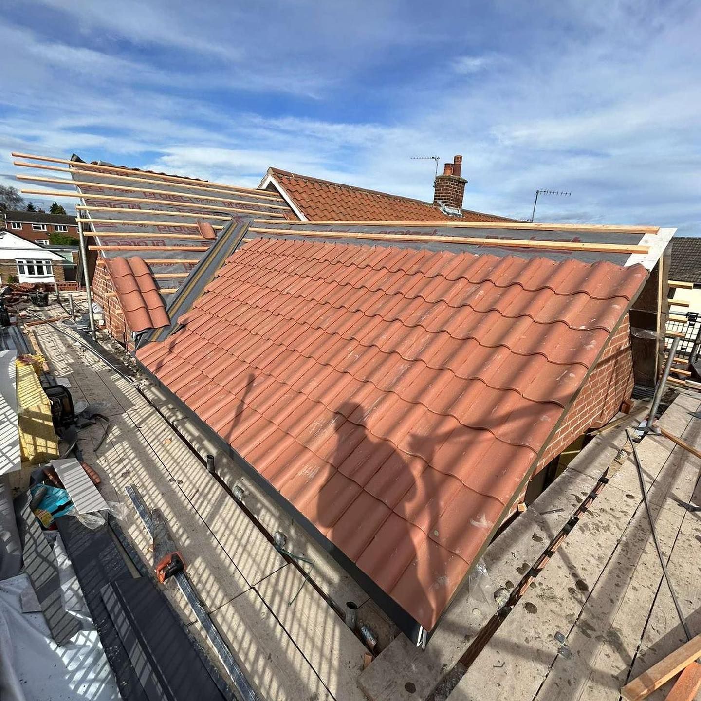 A picture of Hightop Roofers Birmingham replacing a large gable roof