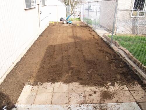 Dirt yard being prepped for planting.