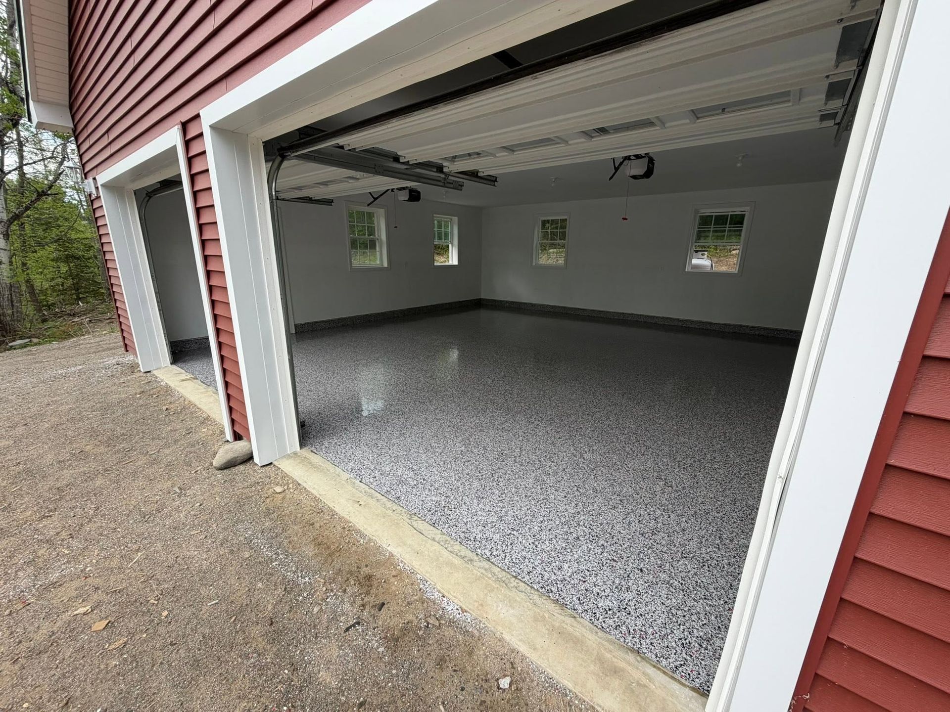 Fleck epoxy garage floor installation, red house in Maine