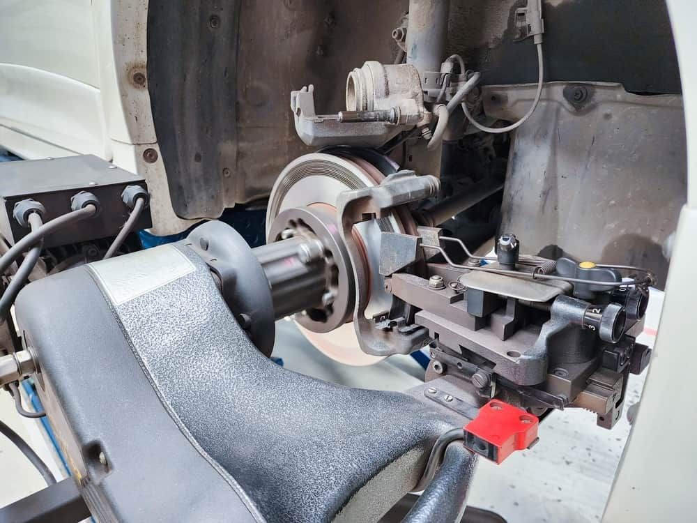 A Brake Lathe Machine Attached to a Car's Wheel Hub — Berkeley Vale Tyre & Mechanical in Fountaindale, NSW