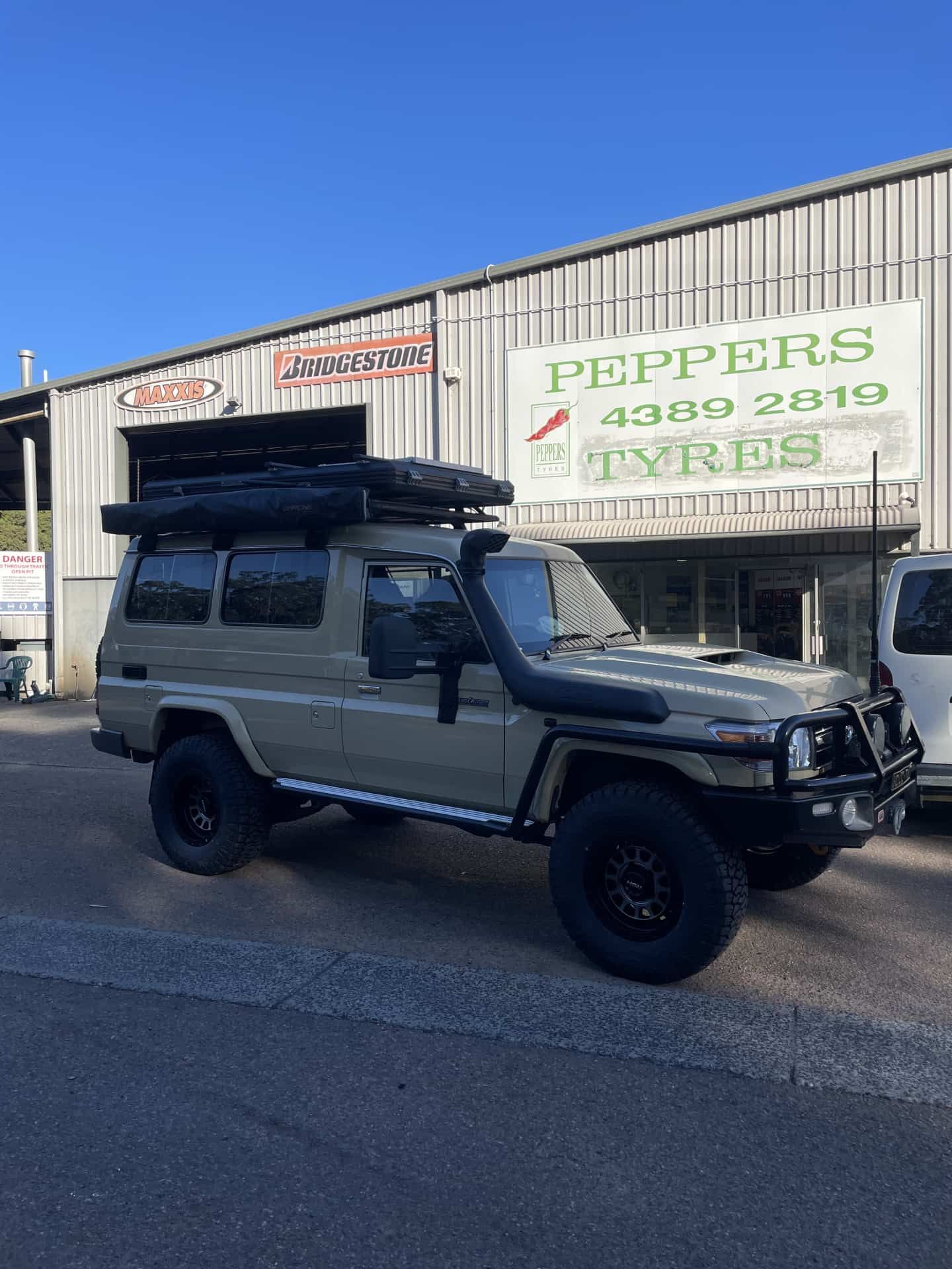 A Tan Toyota Landcruiser Off-road Vehicle — Berkeley Vale Tyre & Mechanical in Fountaindale, NSW