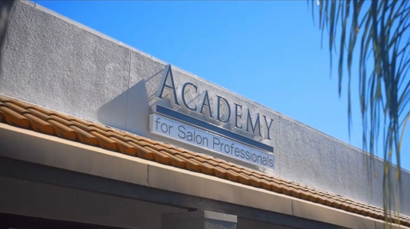 Instructor mentoring a student at Academy LA