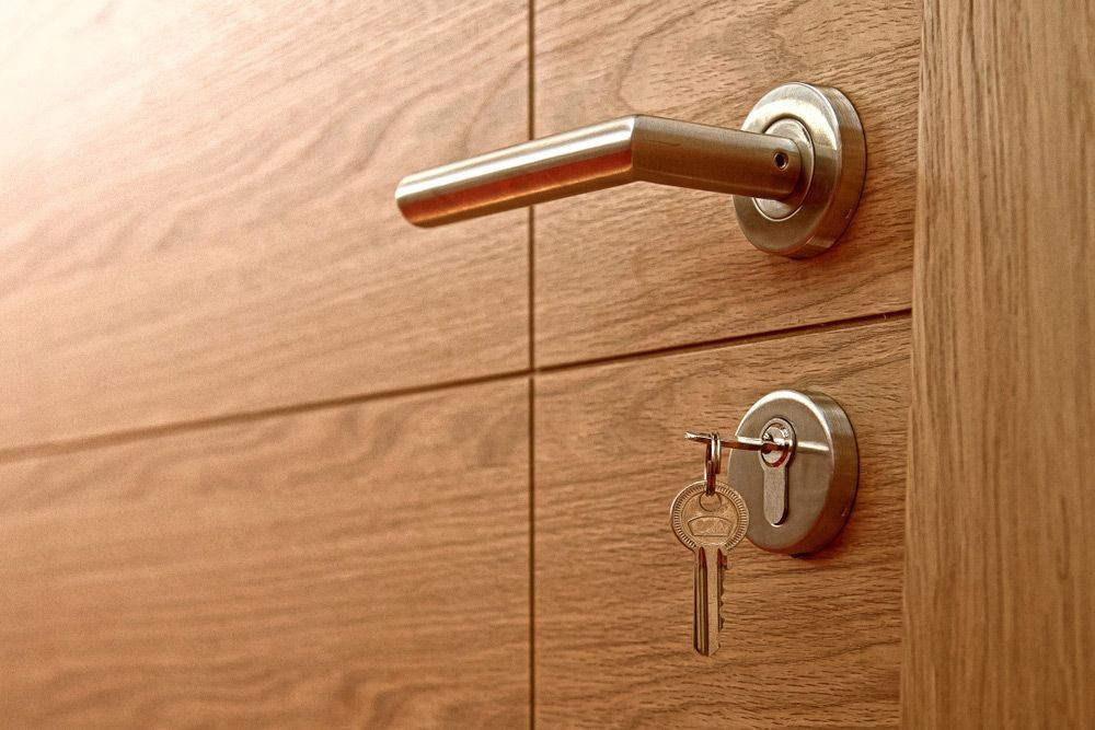 Key Inserted in The Wooden Door Lock