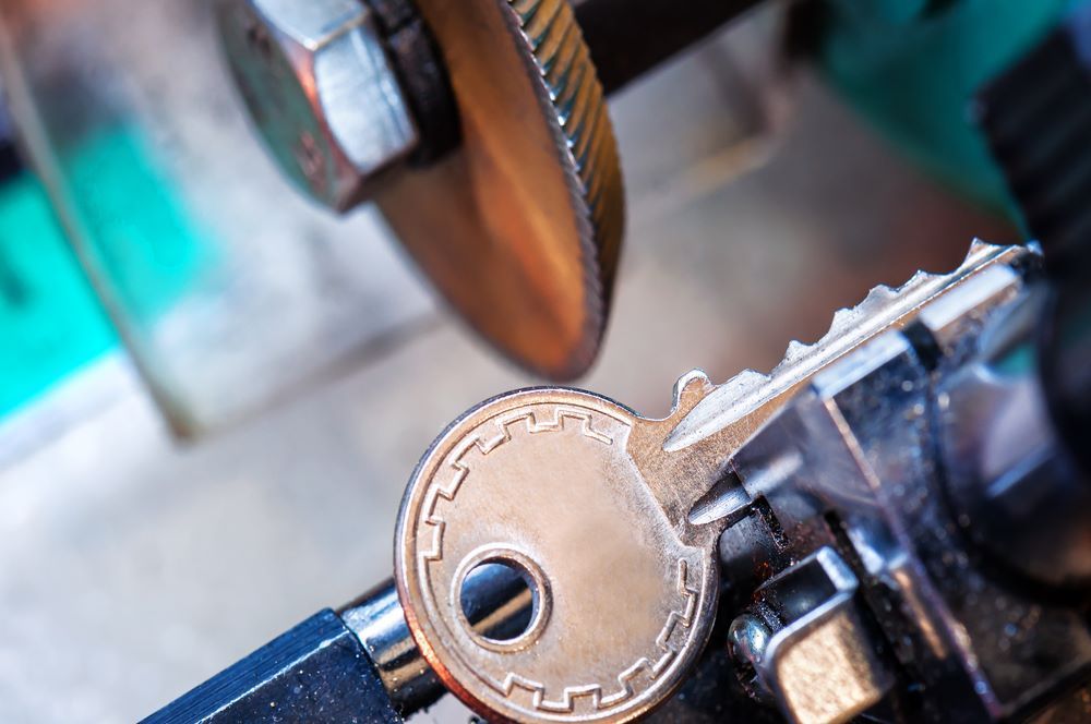 A Close Up of a Key Being Cut by a Machine — Coffs City Lockmart Pty Ltd in Macksville, NSW