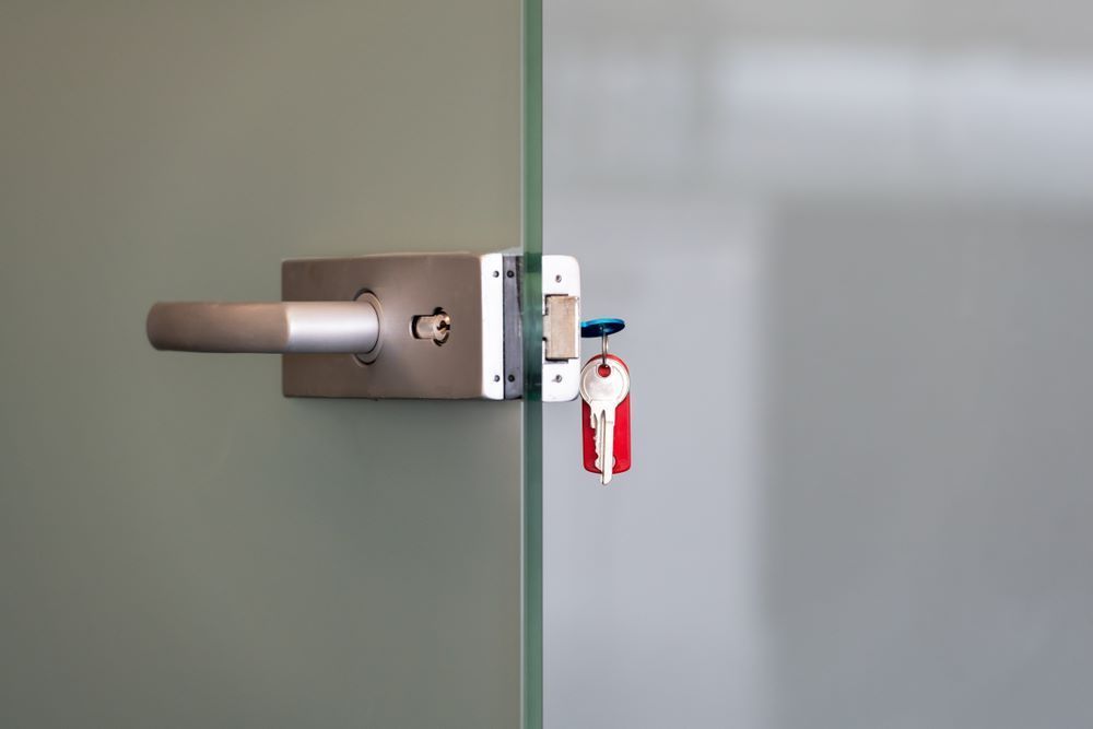 A Close Up of a Door With a Key in It — Coffs City Lockmart Pty Ltd in Woolgoolga, NSW