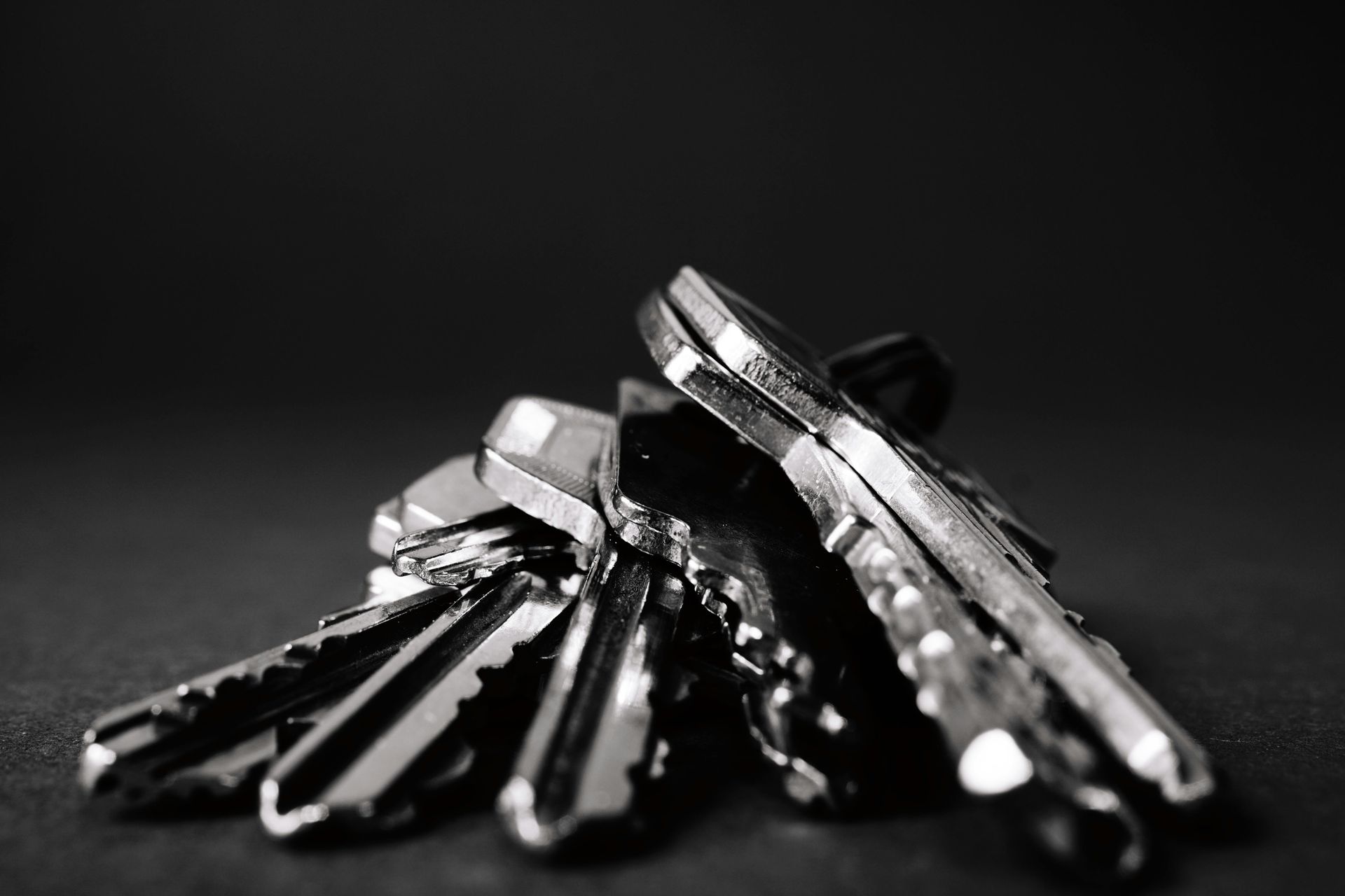 A close up of keys laying on table in black and white  — Coffs City Lockmart Pty Ltd in North Boambee Valley, NSW