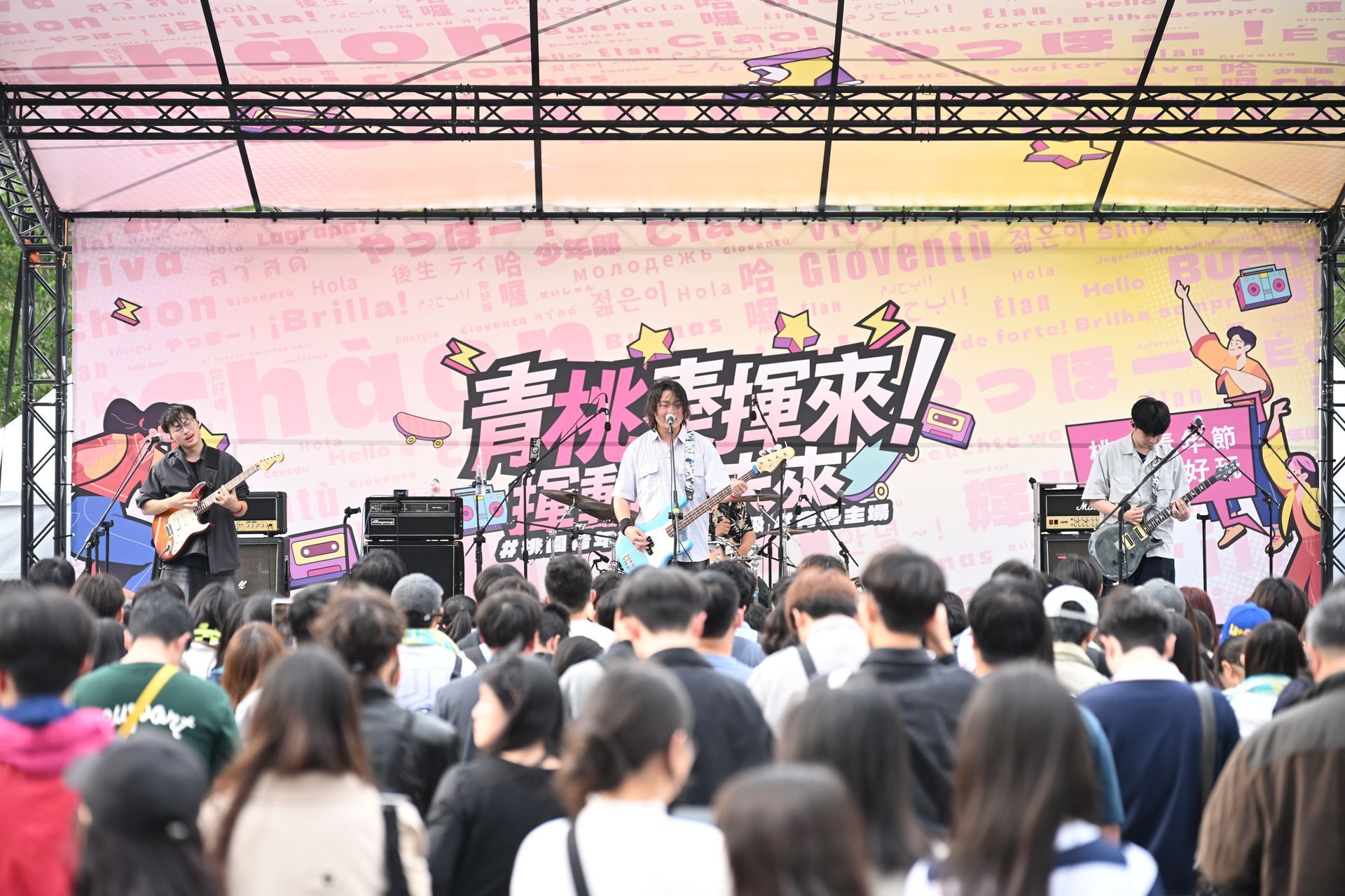 Group of people cutting a ribbon at a pink tea exhibition booth.