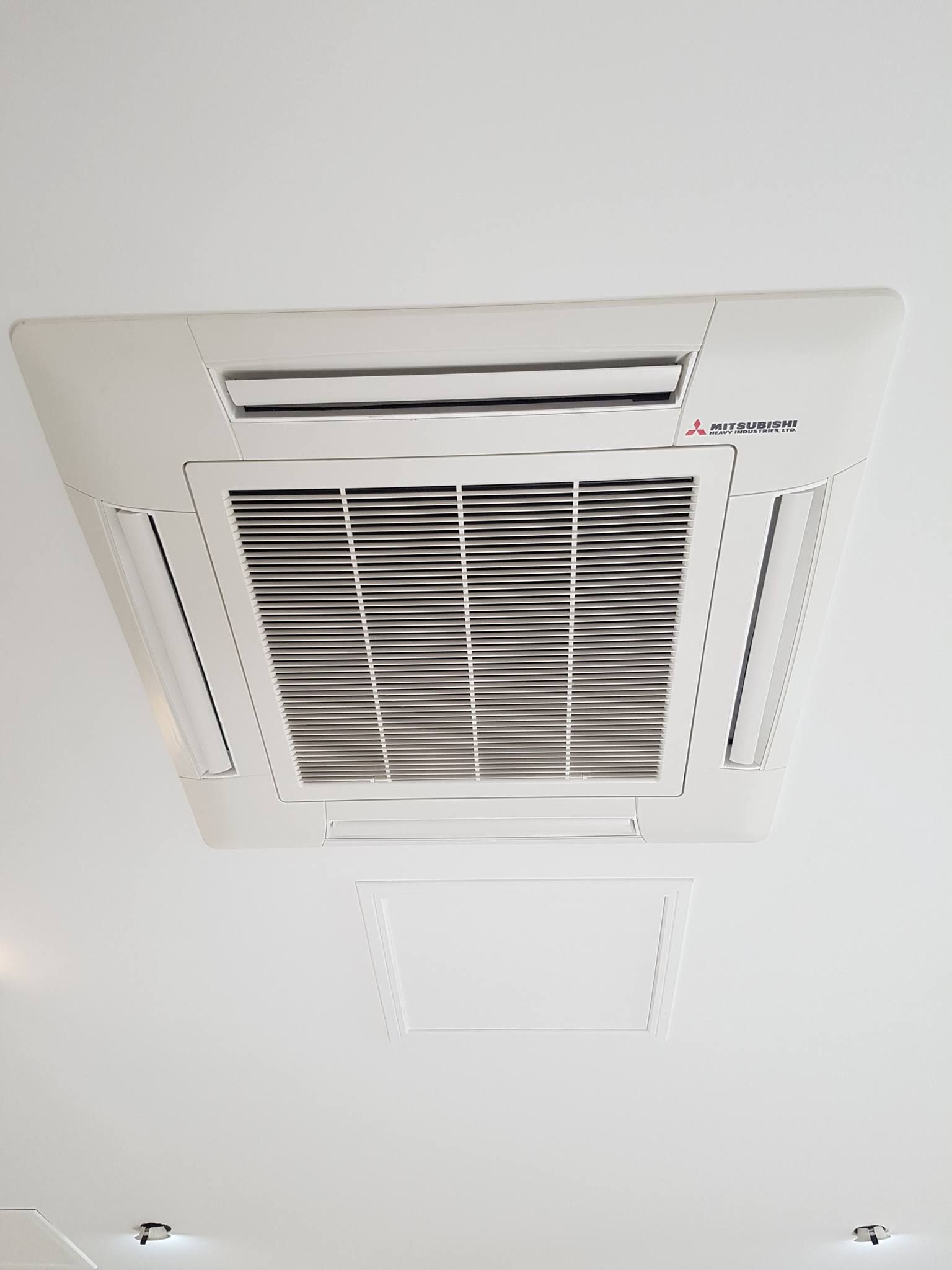 White Ceiling-Mounted Air Conditioning Unit — Bay & Basin Air Conditioning & Refrigeration Pty Ltd in St Georges Basin, NSW