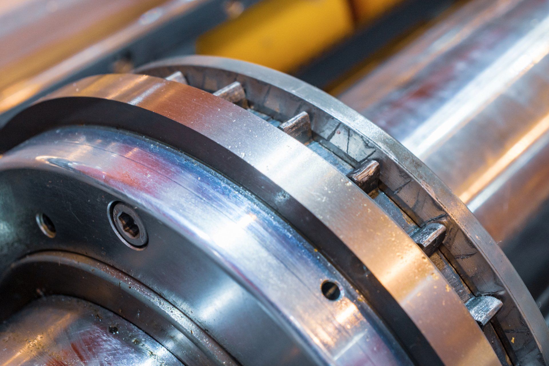 A close up of a metal bearing on a machine.