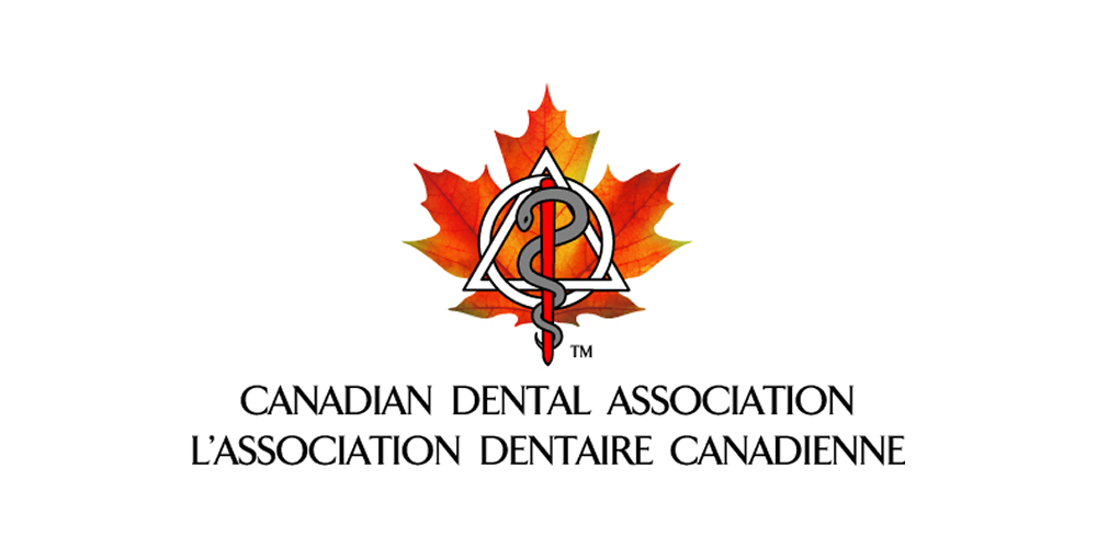 The logo of the Canadian Dental Association featuring a red maple leaf, a triangle, and a serpent-entwined staff.