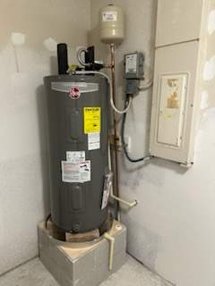 Man fixing a broken water heater
