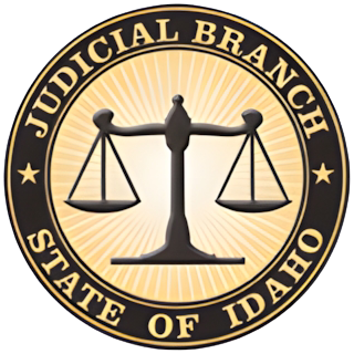 Idaho Judicial Branch seal with scales of justice and text.