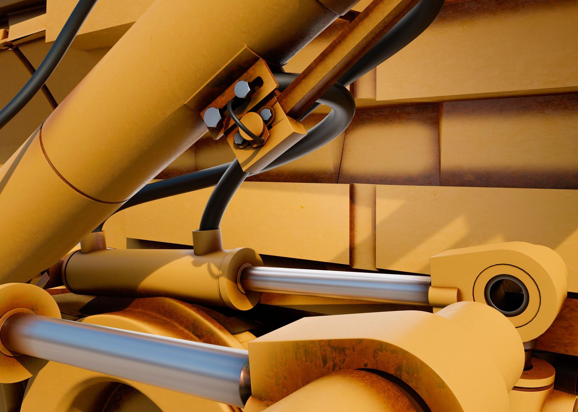 Close-up of yellow metal machinery with silver hydraulic tubes and bolts.