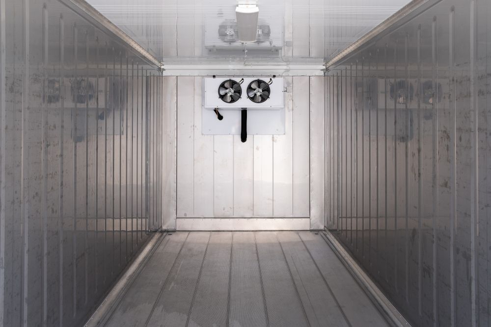 Empty Refrigerated Container Interior With Cooling Unit — Les Carman Cooling Solutions in El Arish, QLD