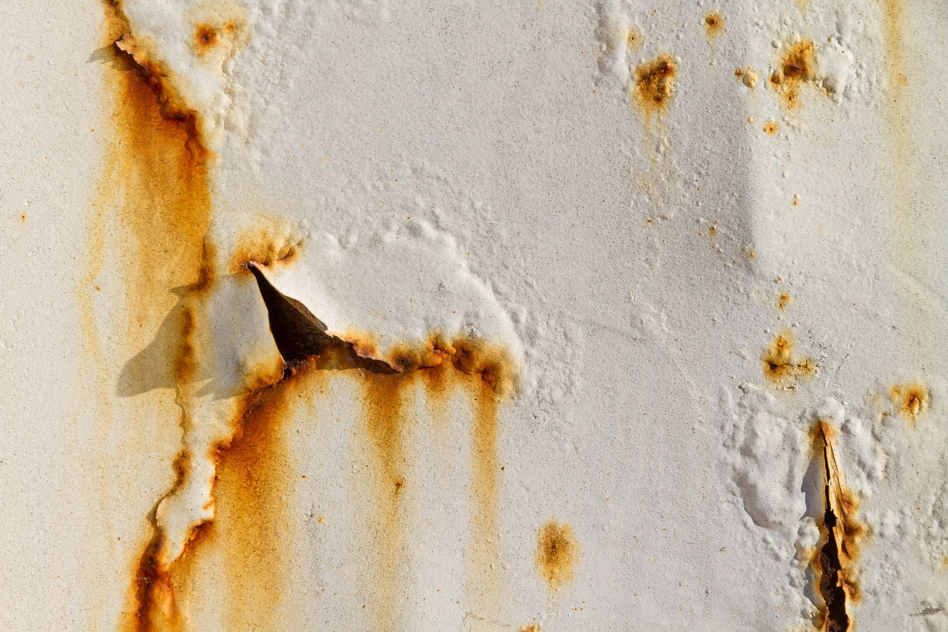 Rust stains on metal panel.