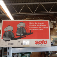 A Solo brand gasoline mistblower box in a store, displaying models 451 and 444 on a red and white background.