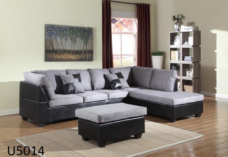 A living room with a sectional couch and an ottoman