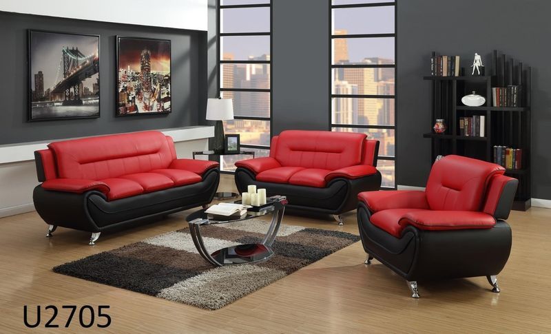 A living room with a red couch and a black chair