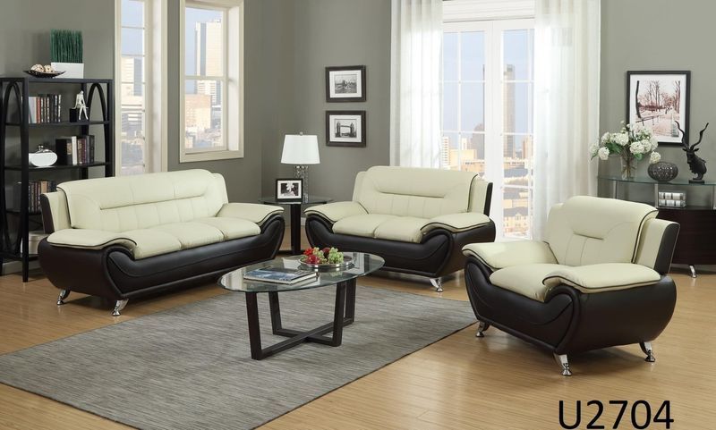 A living room with a couch , chair and coffee table