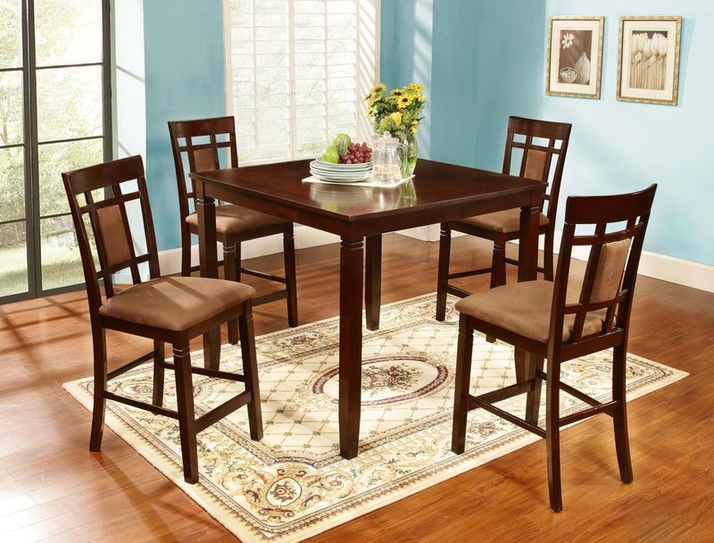 A dining room with a table and chairs and a rug