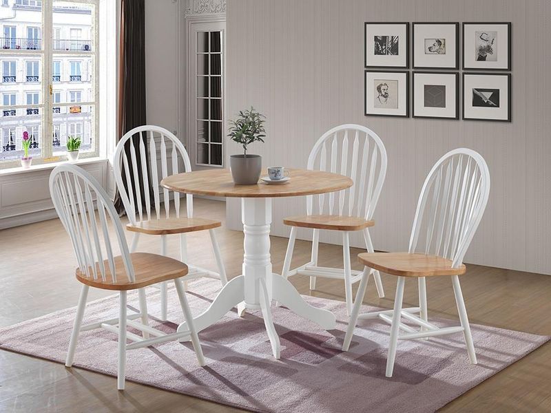 There is a table and chairs in the room.