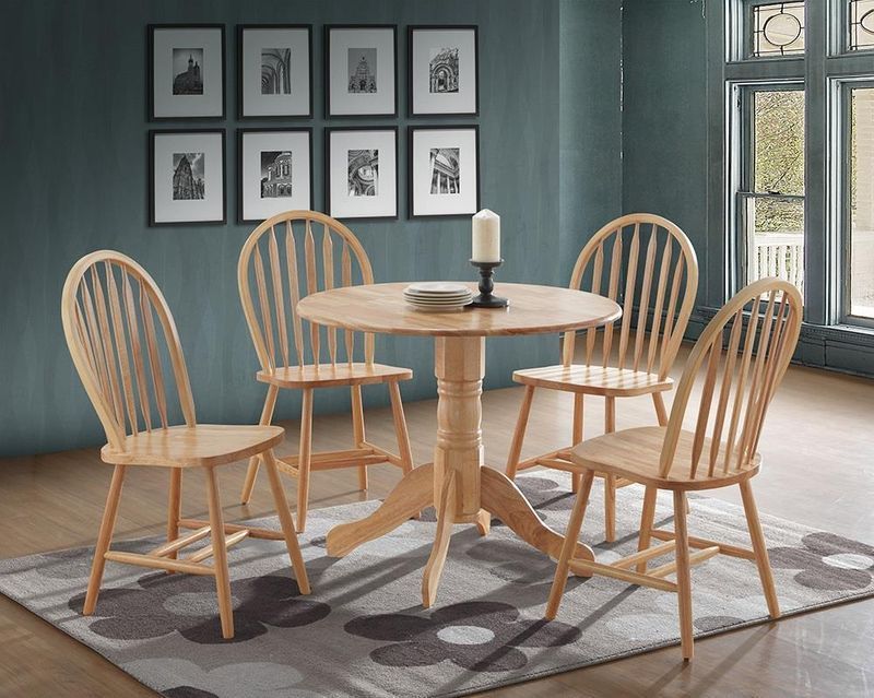 There is a table and chairs in the room.