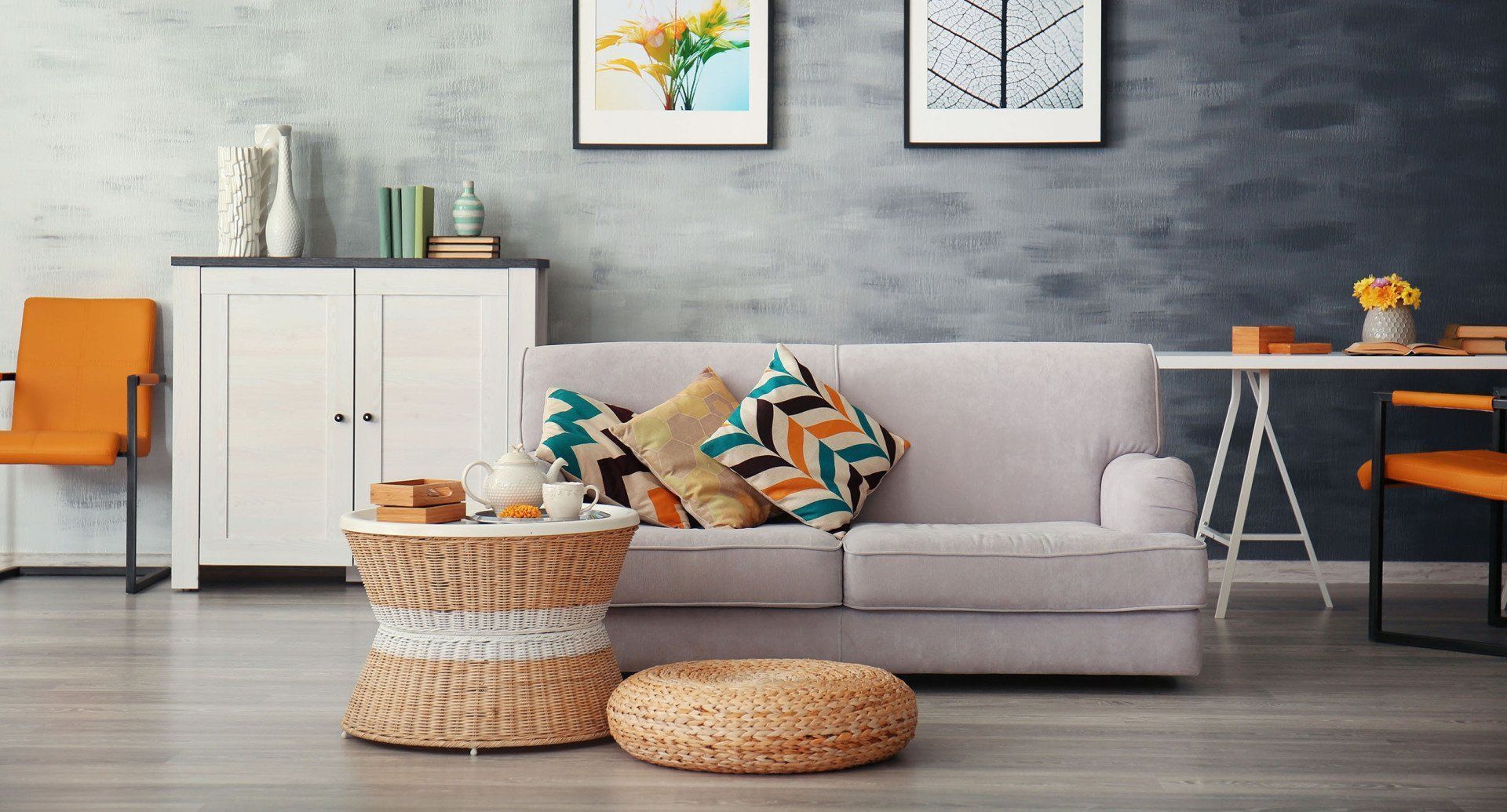 A living room with a couch , table and chairs.