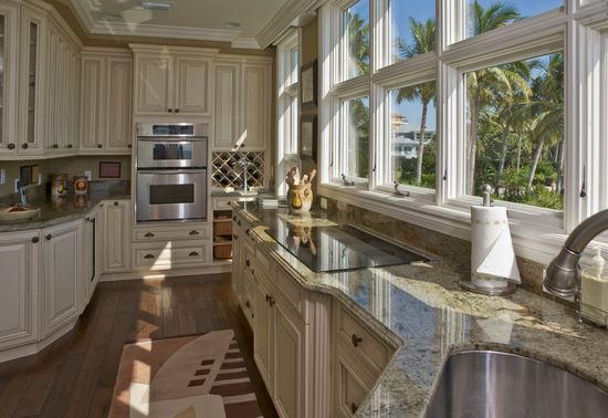 Home Cleaning Service — Cleaning Team Wiping the Floor in Jensen Beach, FL Home Cleaning Service — Cleaning Team Wiping the Floor in Jensen Beach, FL