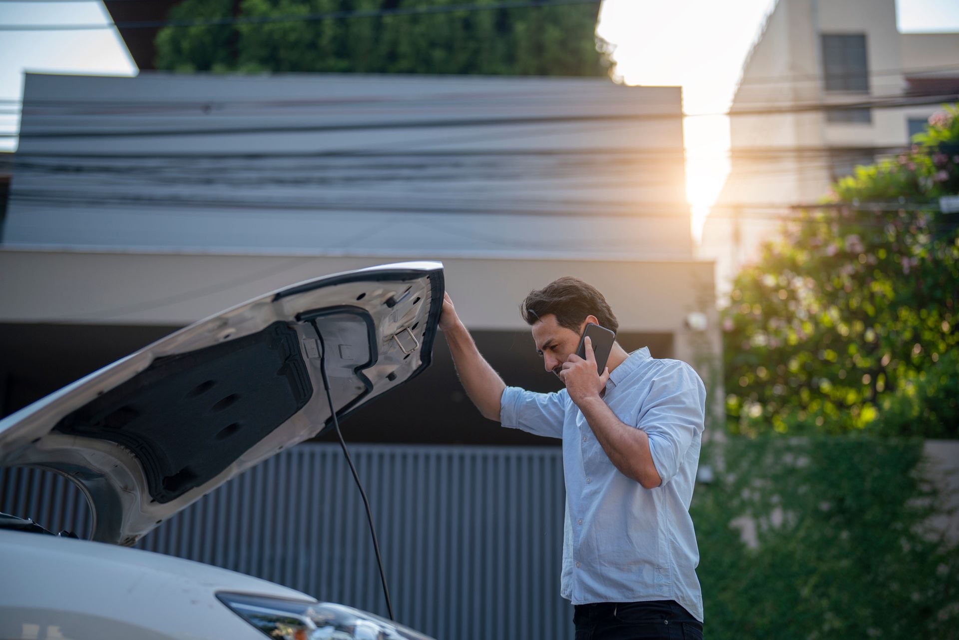 A person with a Car breakdown calling to his car insurance