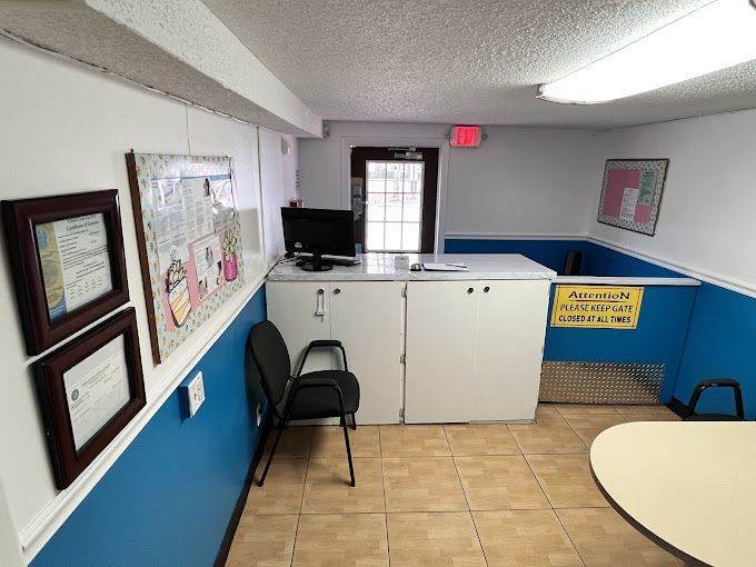 A room with blue and white walls and a table