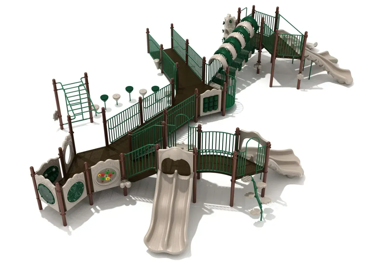 Outdoor playground with green metal climbing structures, slides, and bridges on beige surfacing