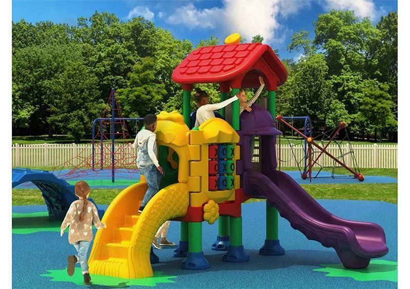 Children playing on a colorful playground with slides and climbing structures in a park setting.