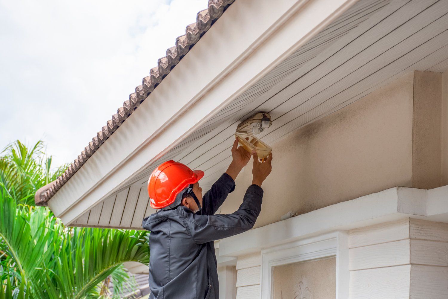 Electrician Fixing Light — Pensacola, FL — McLemore Electric, Inc.