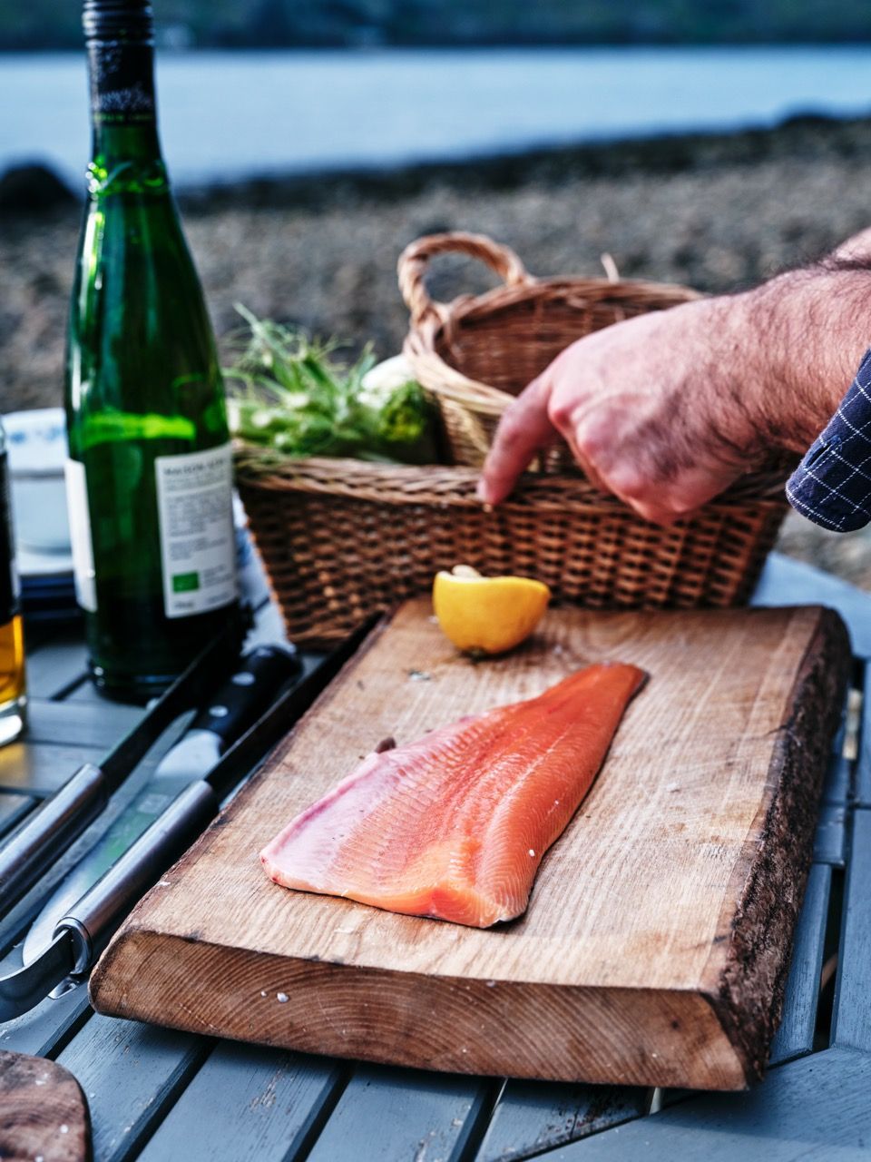 Wild Sea Trout on a wooden chopping board.