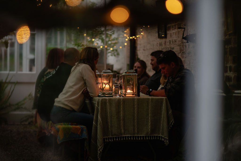 Guests enjoying wild kabn kitchen at twilight.