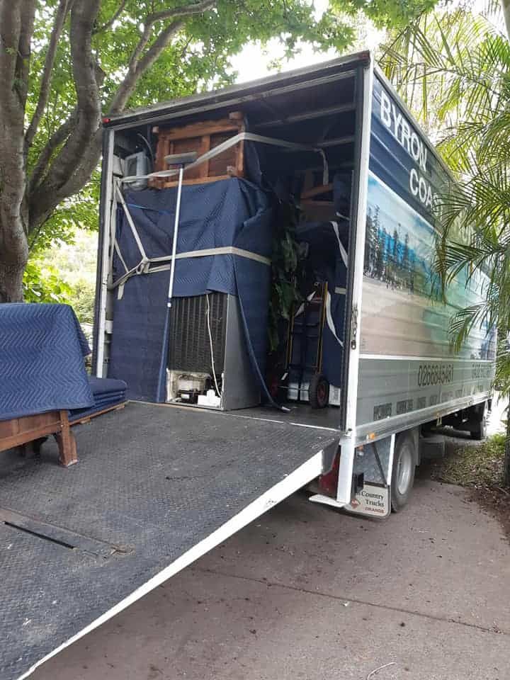 A Moving Truck Is Parked On The Side Of The Road  — Byron Coast Removals In Ballina, NSW