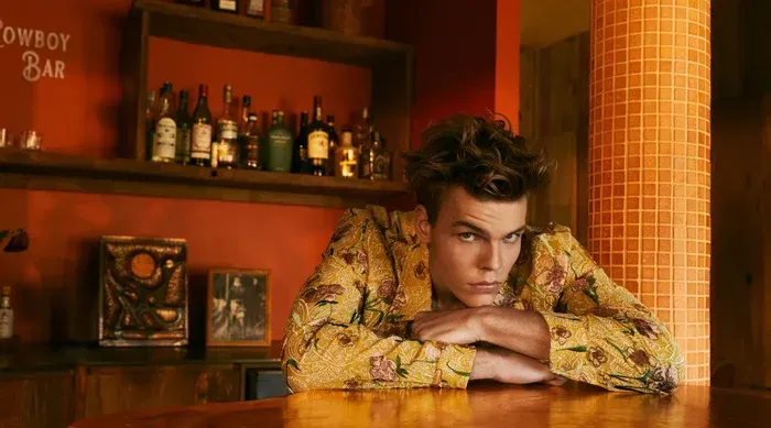 evo professional haircare campaign featuring a model in a retro bar