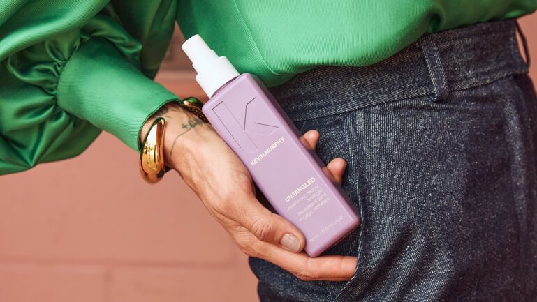 A KEVIN.MURPHY model holding Untangled