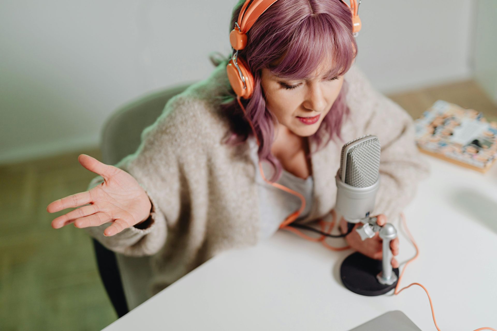 Salon owner recording content, representing the media company mindset for long-term success.