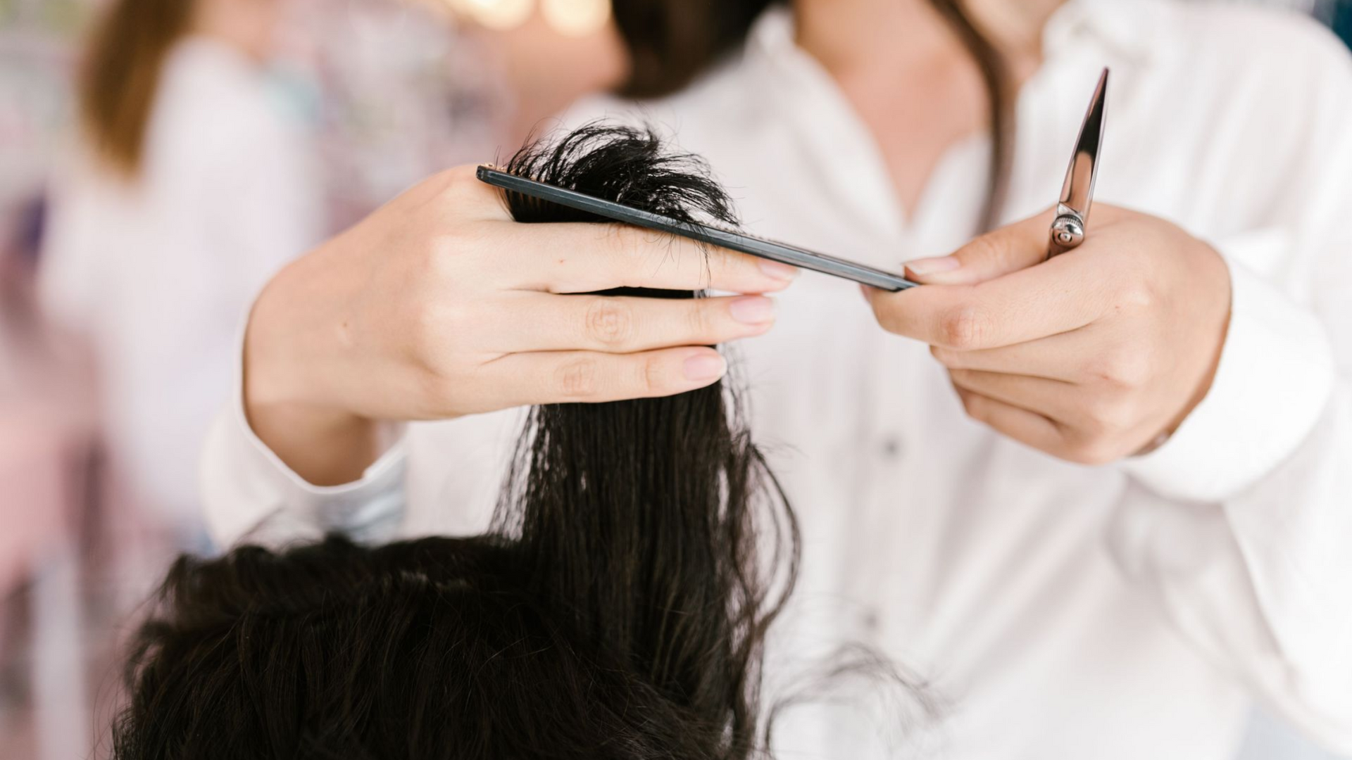 A stylist cutting hair