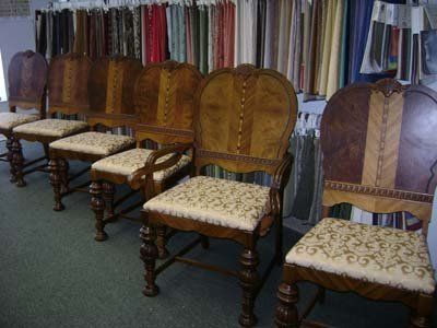 Antique chairs in front of upholstery fabrics