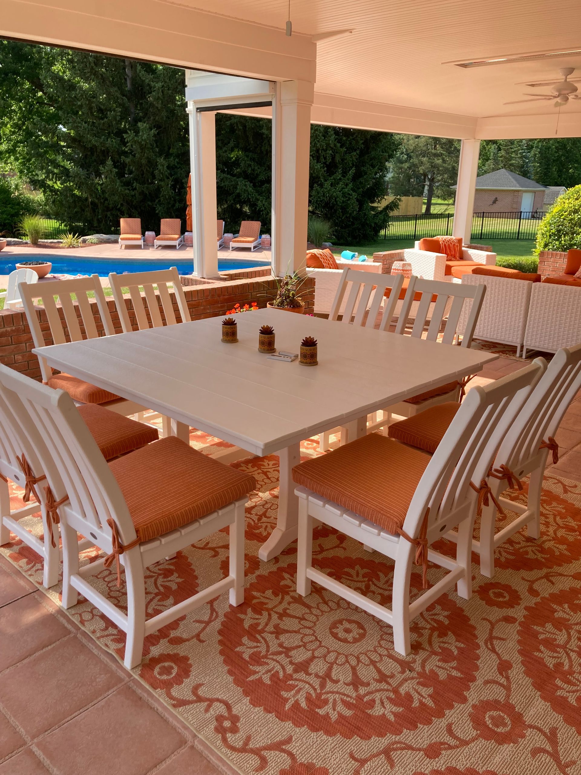 An outdoor eating area featuring chairs with custom upholstery 