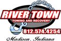 Red truck door with River Town Towing and Recovery logo, phone number, and Madison, Indiana text